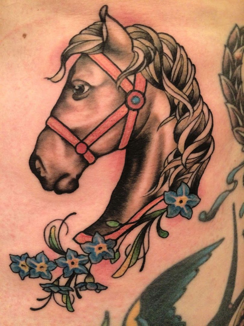 a horse with a flower in its mane