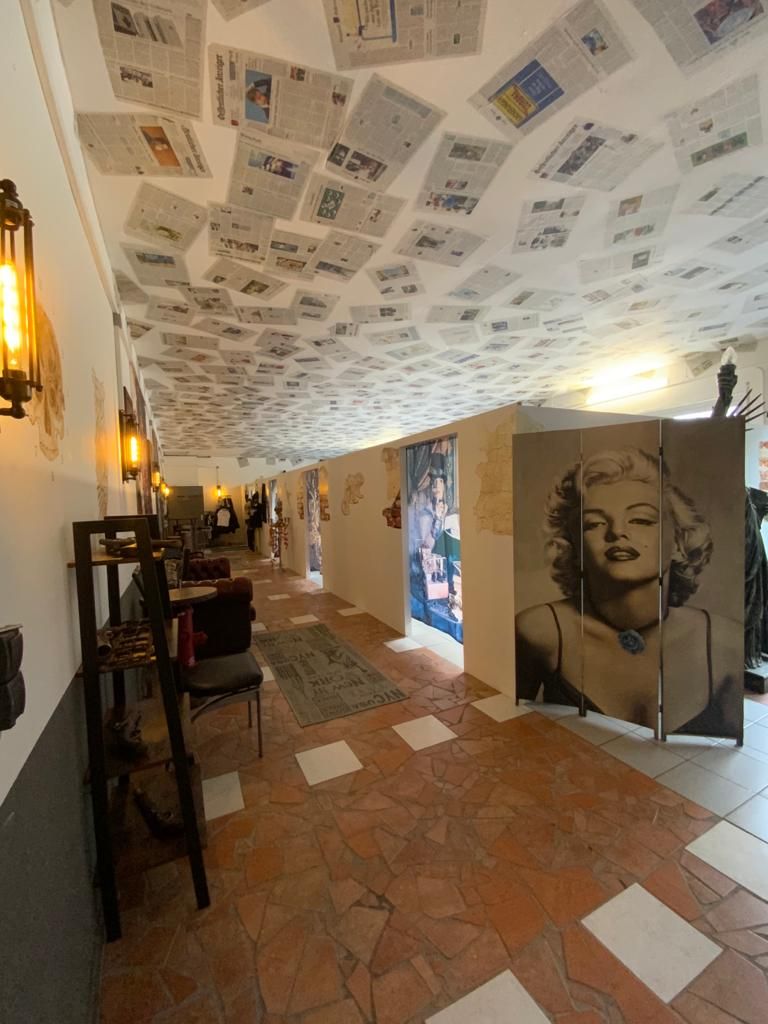 a room with a large mural of a woman