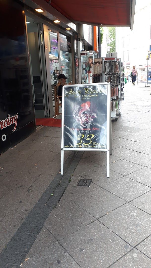 a sign on the sidewalk in front of a restaurant