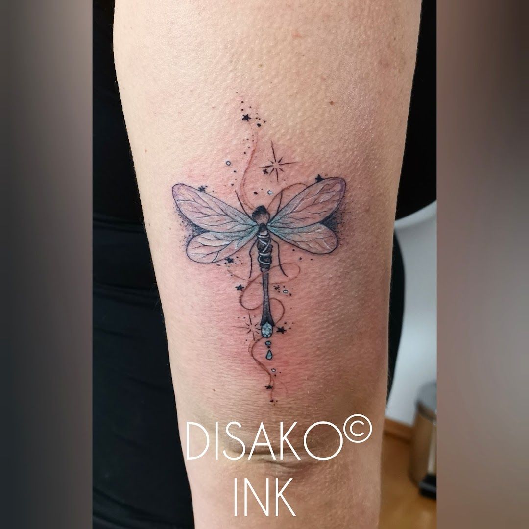 a cover-up tattoo with a dragon on the arm, bamberg, germany