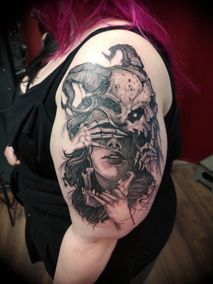 a woman with a skull and a raven on her shoulder