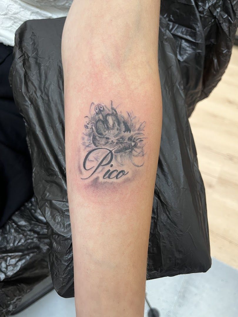 a narben tattoo with a flower on the arm, rems-murr, germany