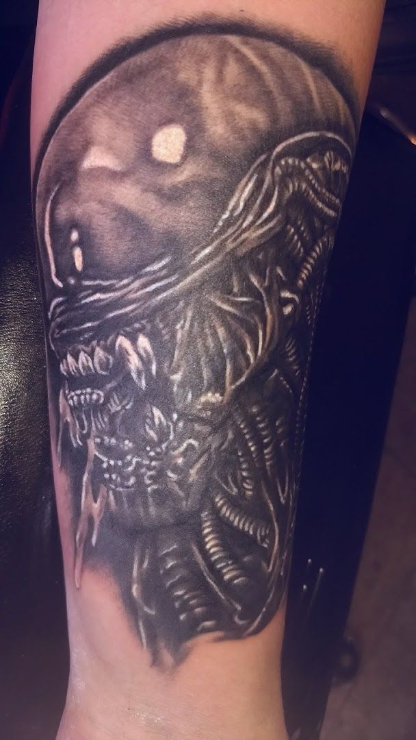 a japanische tattoos in leipzig of a alien with a skull on it, lahn-dill-kreis, germany