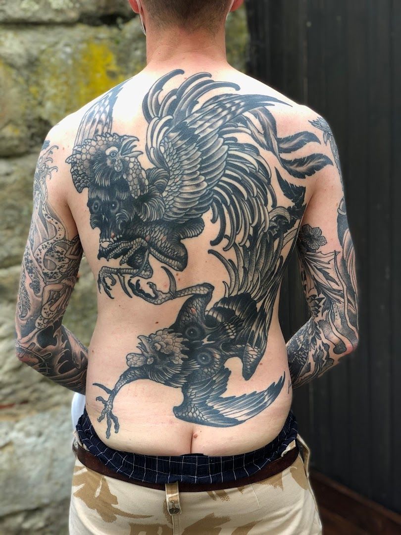 a man with a japanische tattoos in leipzig on his back, forchheim, germany