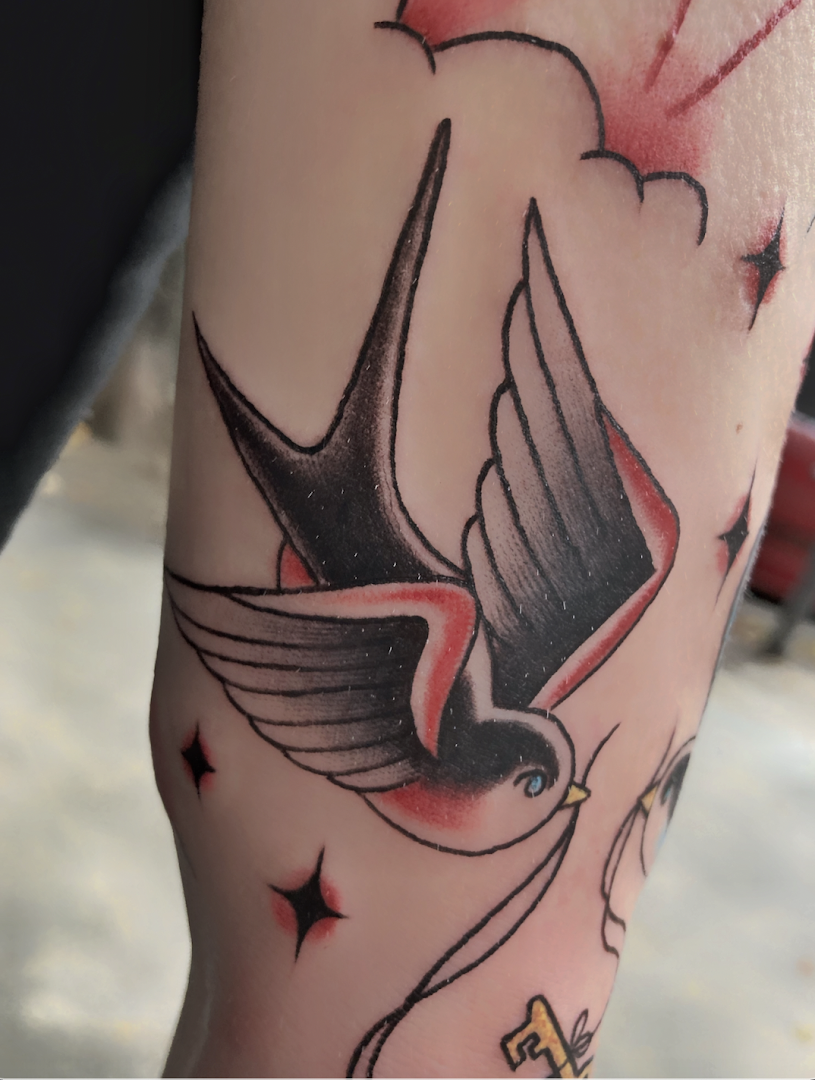 a cover-up tattoo with a bird on it, berlin, germany