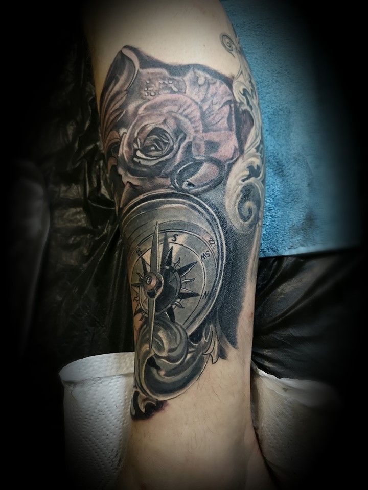 a black and grey cover-up tattoo of a clock and roses, neustadt (aisch)-bad windsheim, germany