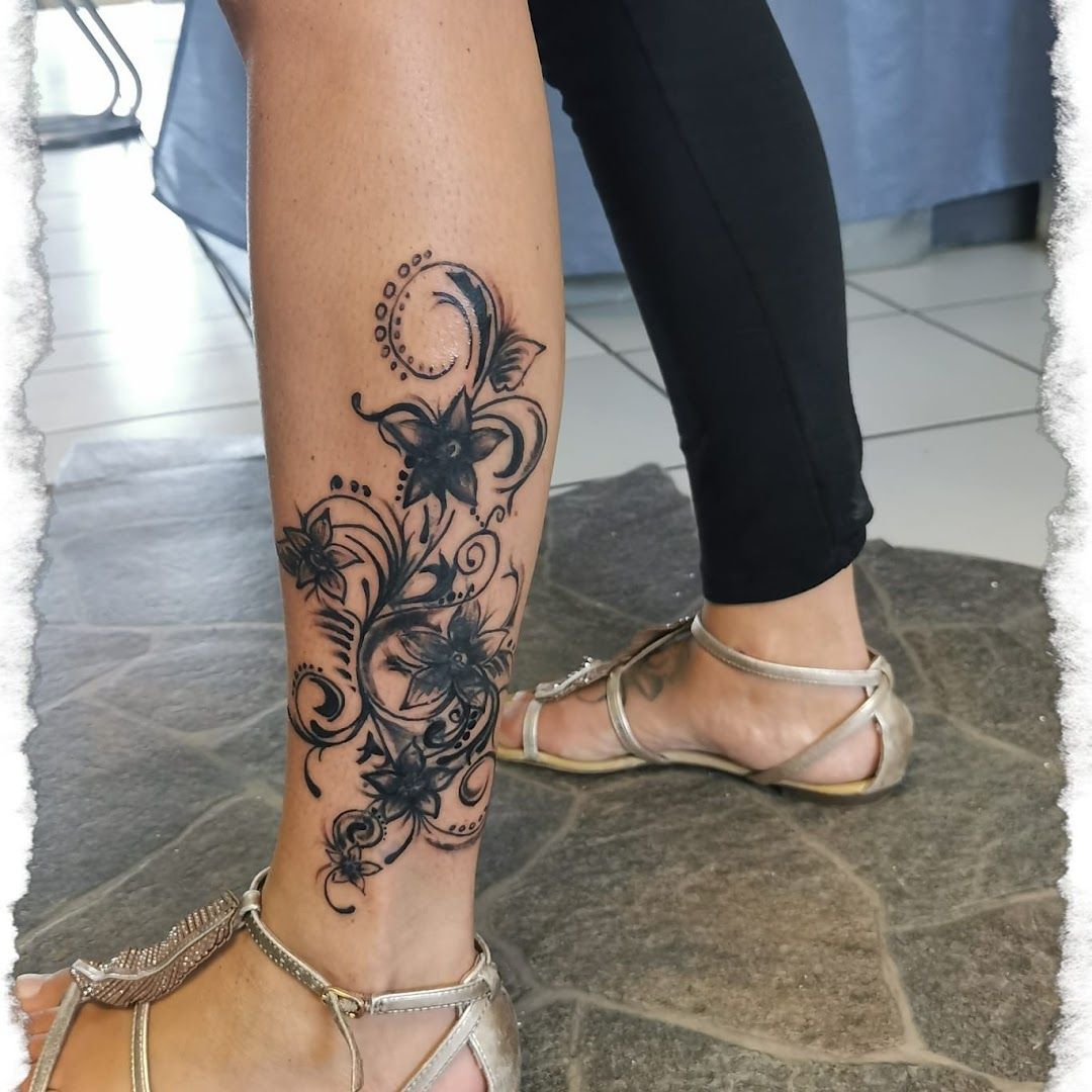 a woman's foot with a narben tattoo design on it, neunkirchen, germany