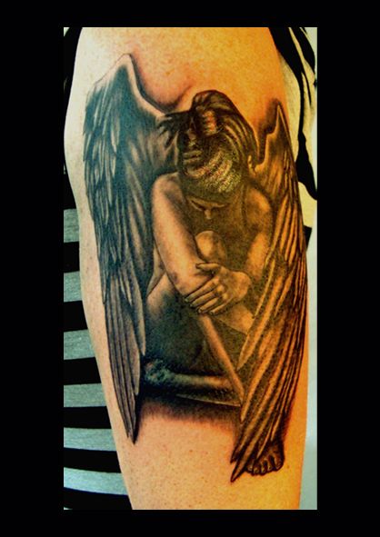 a cover-up tattoo of an angel holding a baby, rhein-sieg-kreis, germany