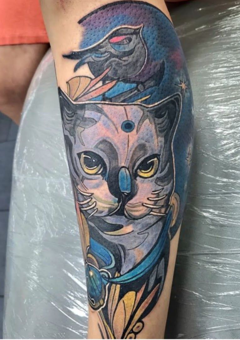 a cat cover-up tattoo on the arm, fürstenfeldbruck, germany