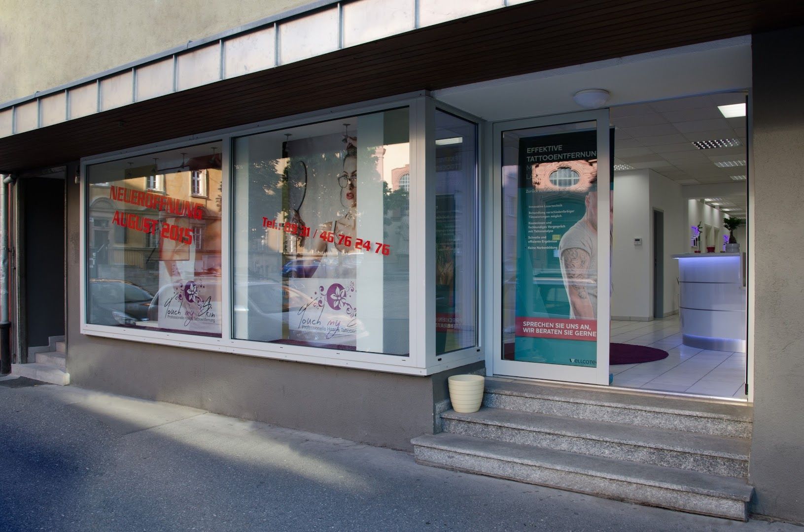 a store front with a window and a sign