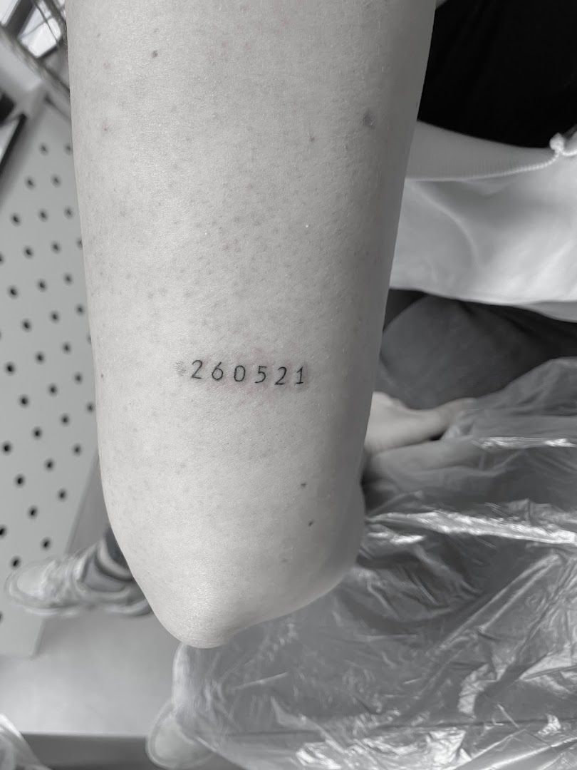 a cover-up tattoo with the number 202 on it, aichach-friedberg, germany