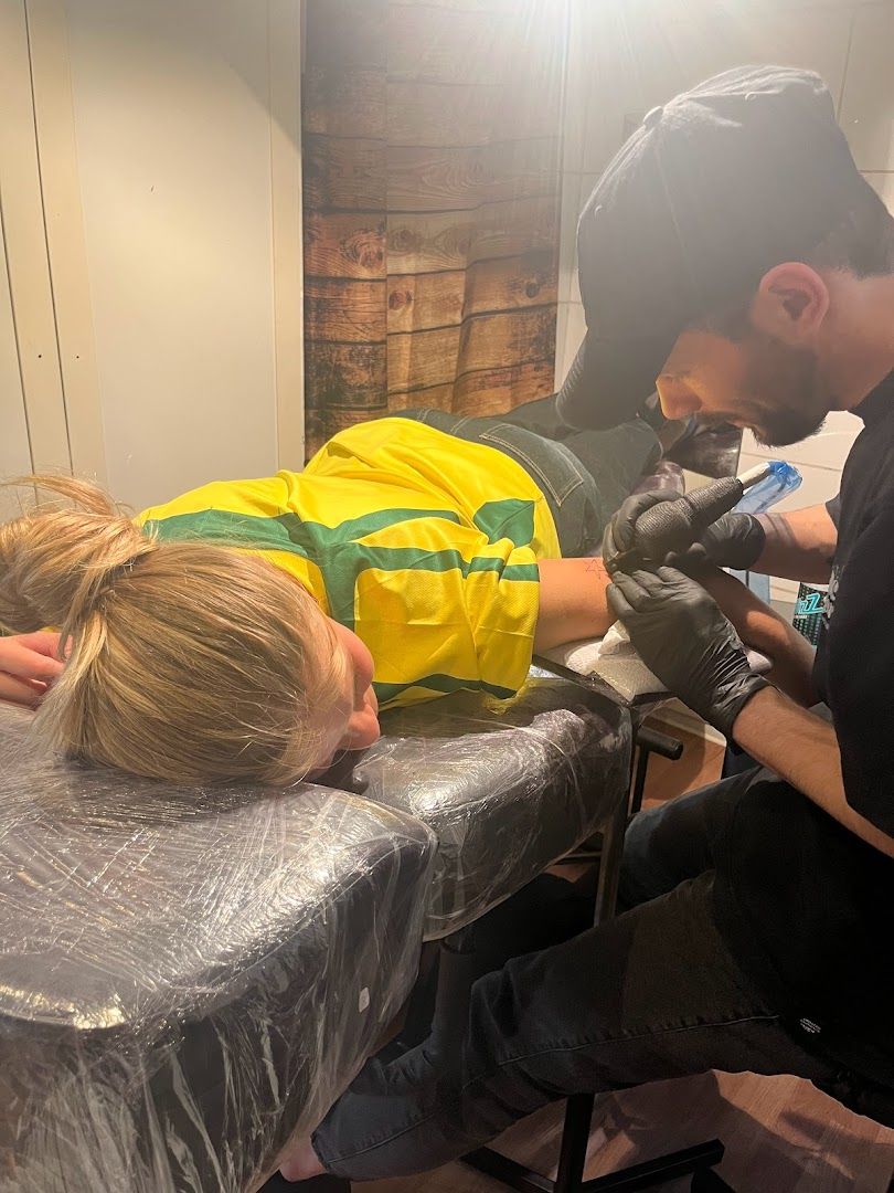 a man getting his hair cut by a barber