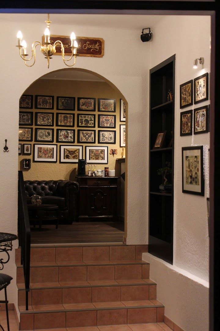 a hallway with a staircase leading to a living room