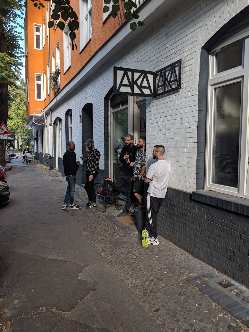 a group of people standing outside of a building