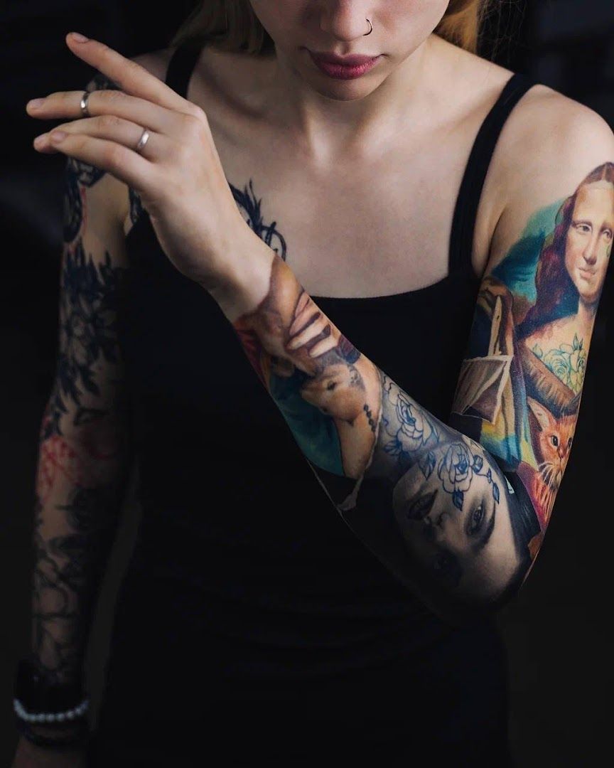 a woman with cover-up tattoos on her arm, sonneberg, germany