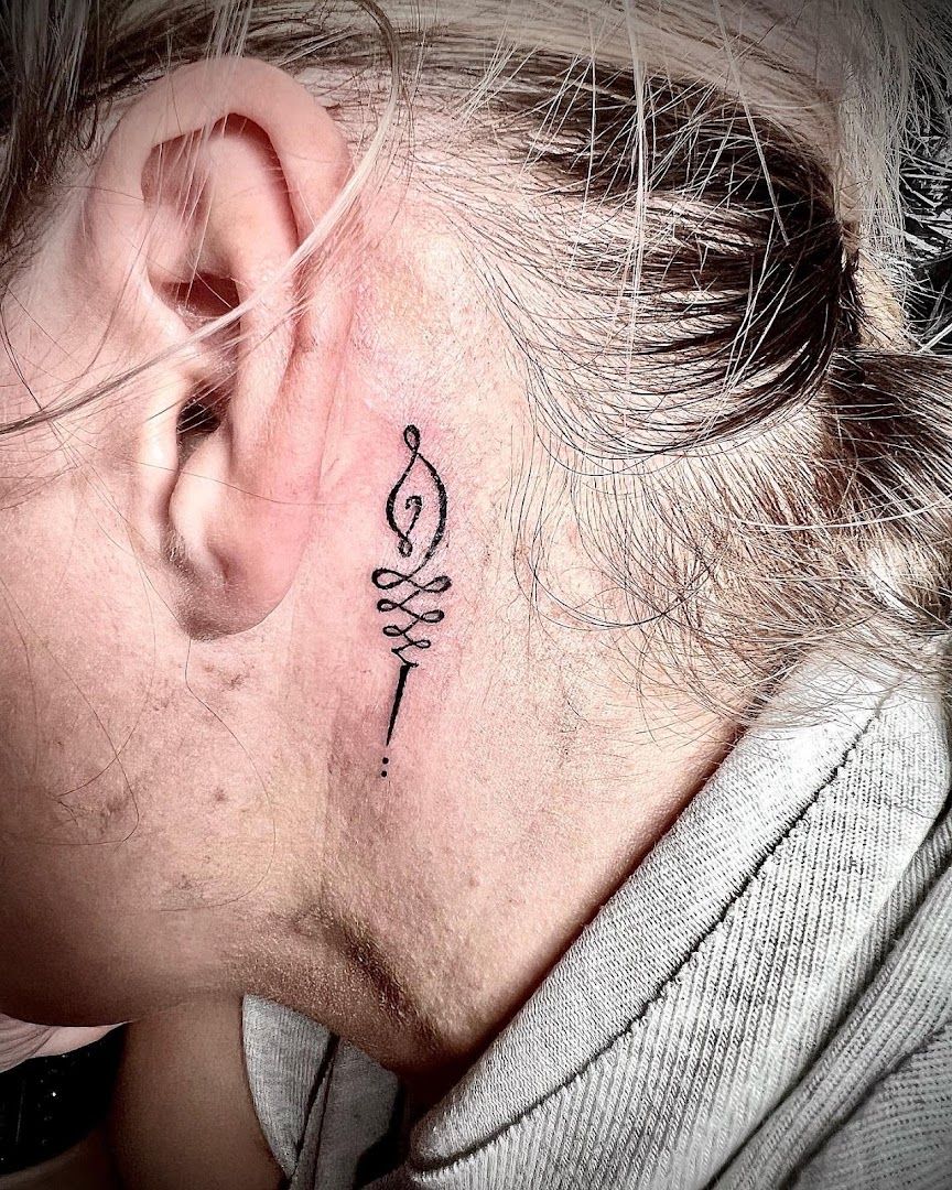 a woman with a small narben tattoo behind her ear, kreisfreie stadt augsburg, germany