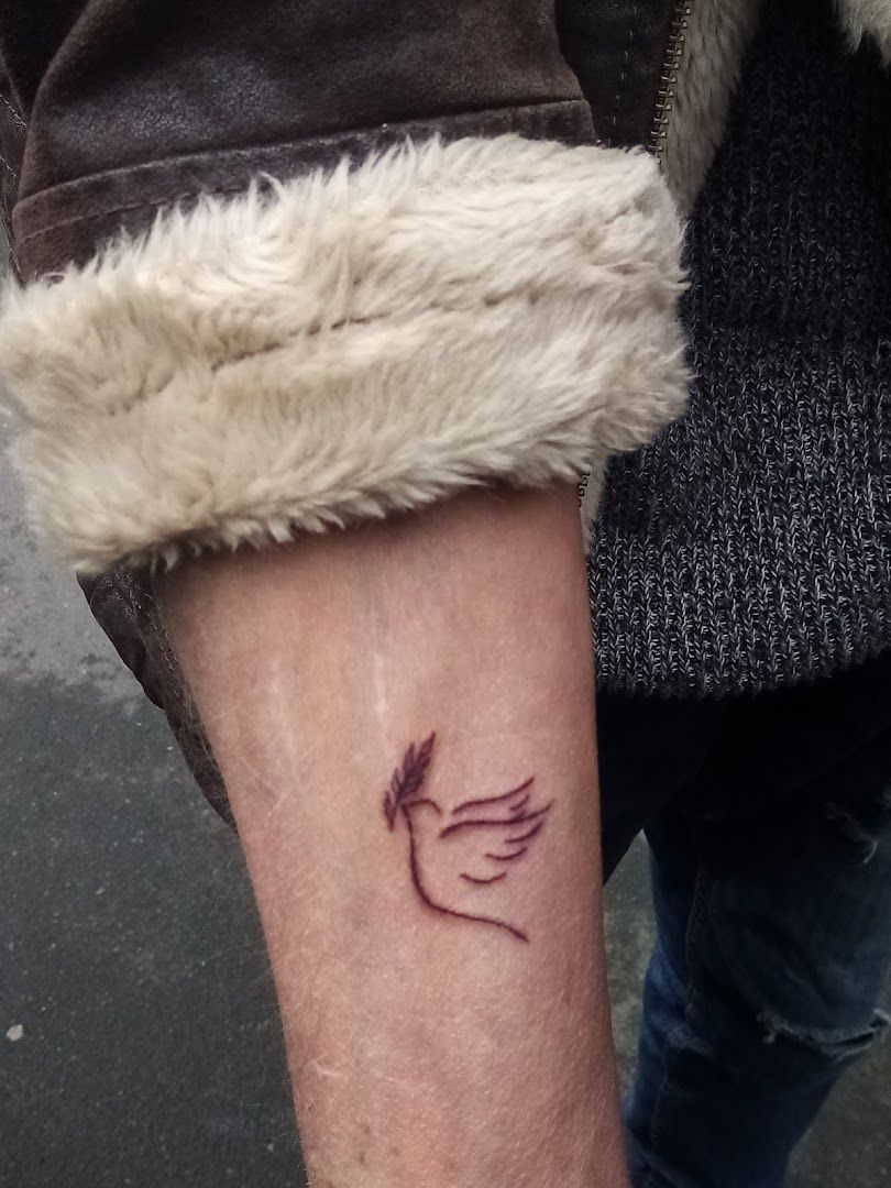 a narben tattoo with a bird on it, limburg-weilburg, germany