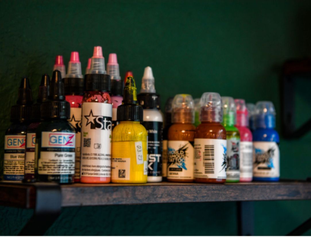a shelf with many different colored inks