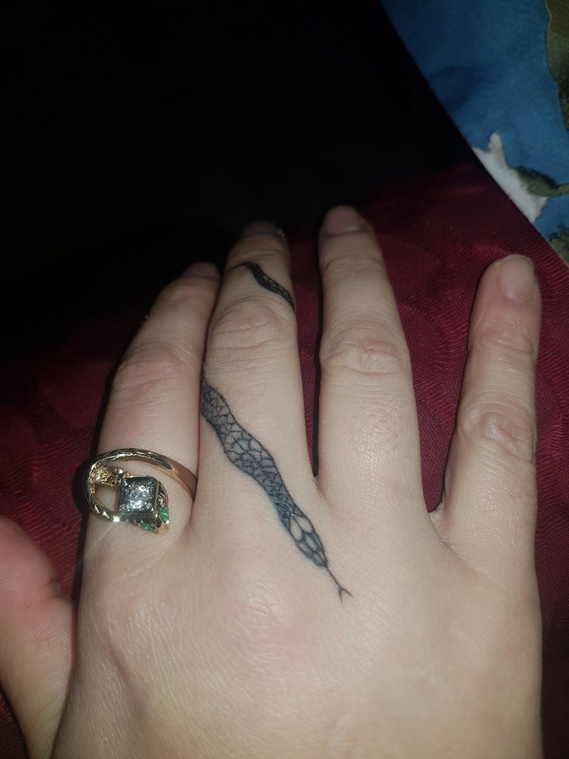 a person's hand with a cover-up tattoo on it, bochum, germany