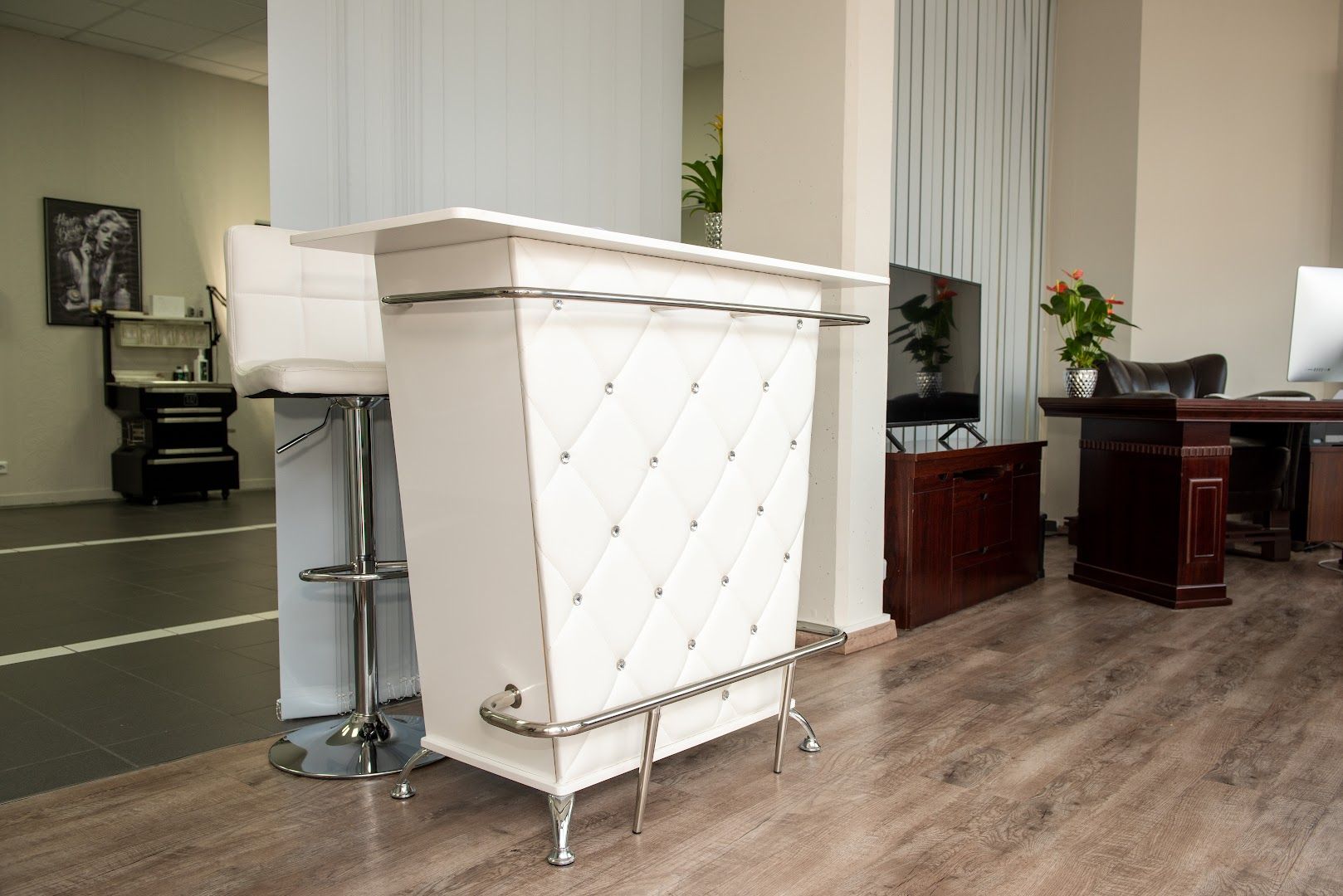 a white cabinet with a silver handle