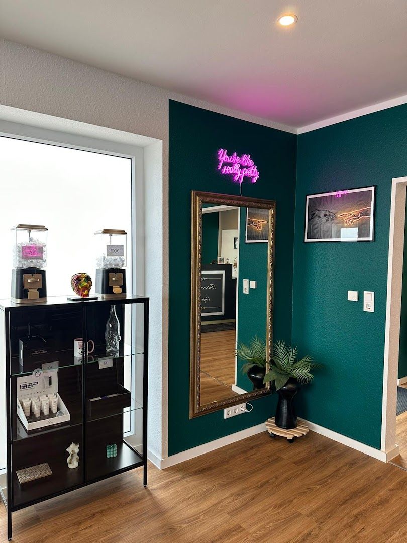 a room with a mirror and a shelf