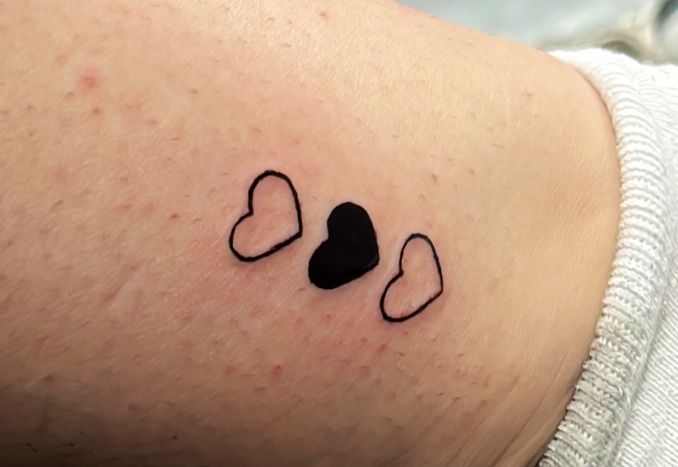 a small heart narben tattoo on the wrist, bodenseekreis, germany