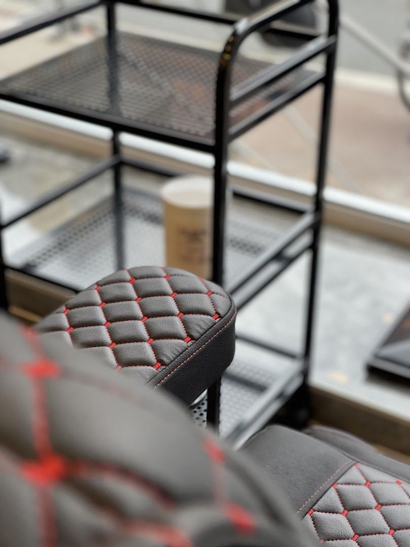 a pair of black and red leather seats