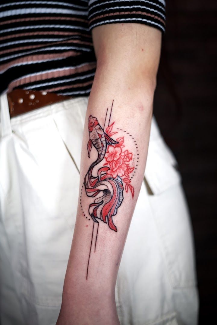 a narben tattoo of a fish on the arm, berlin, germany