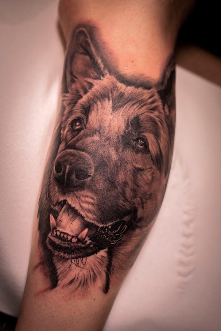 a black and white cover-up tattoo of a dog, viersen, germany