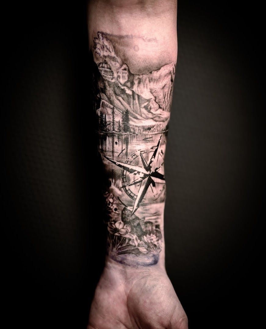 a cover-up tattoo of a man's hand with a cityscape, bad kreuznach, germany