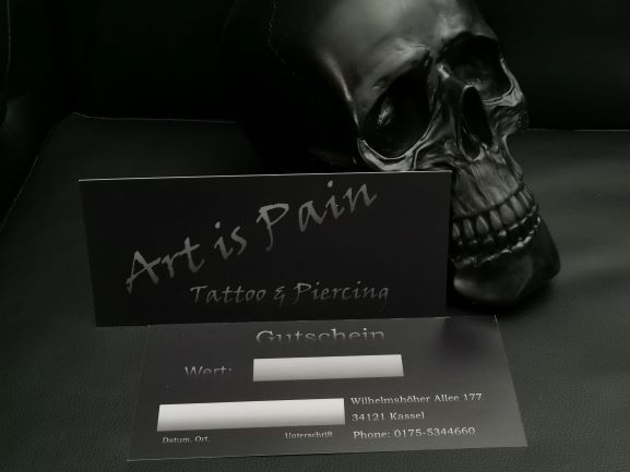 a skull head with a business card on it