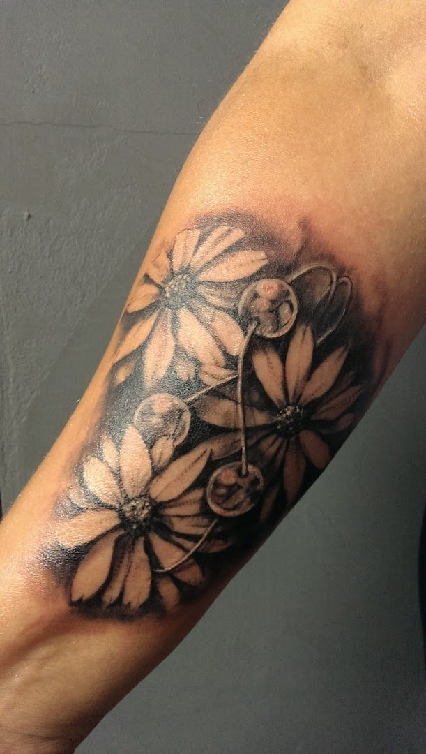 a black and white cover-up tattoo of a flower, sigmaringen, germany