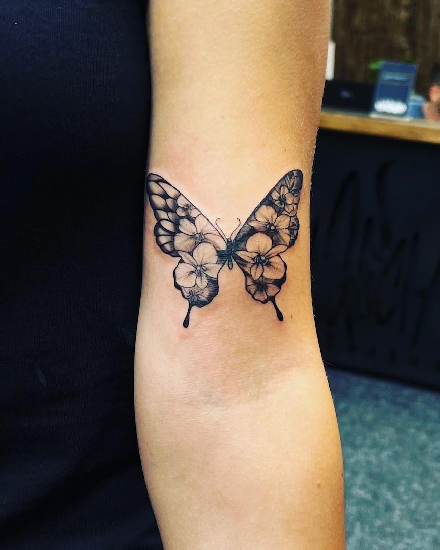 a black and white butterfly cover-up tattoo on the wrist, mönchengladbach, germany