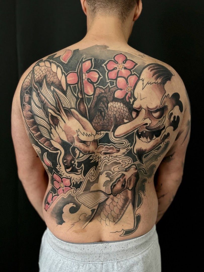 a man with a japanische tattoos in leipzig on his back, ravensburg, germany