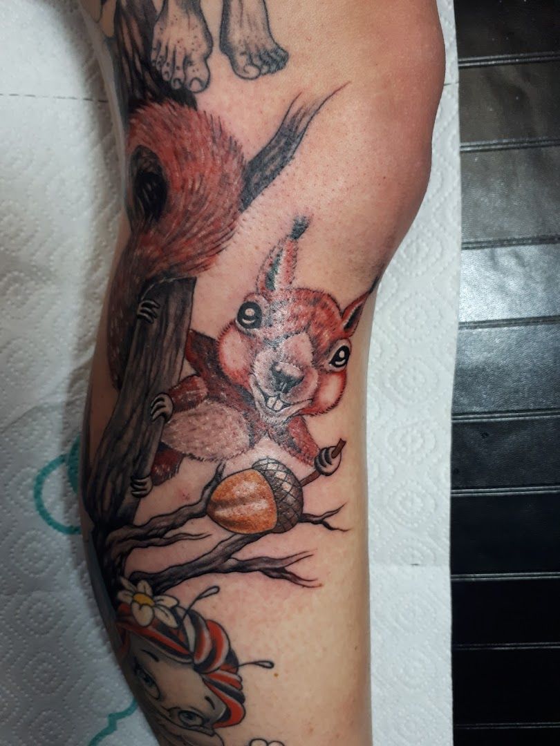 a cover-up tattoo of a fox and a bird on the arm, chemnitz, germany