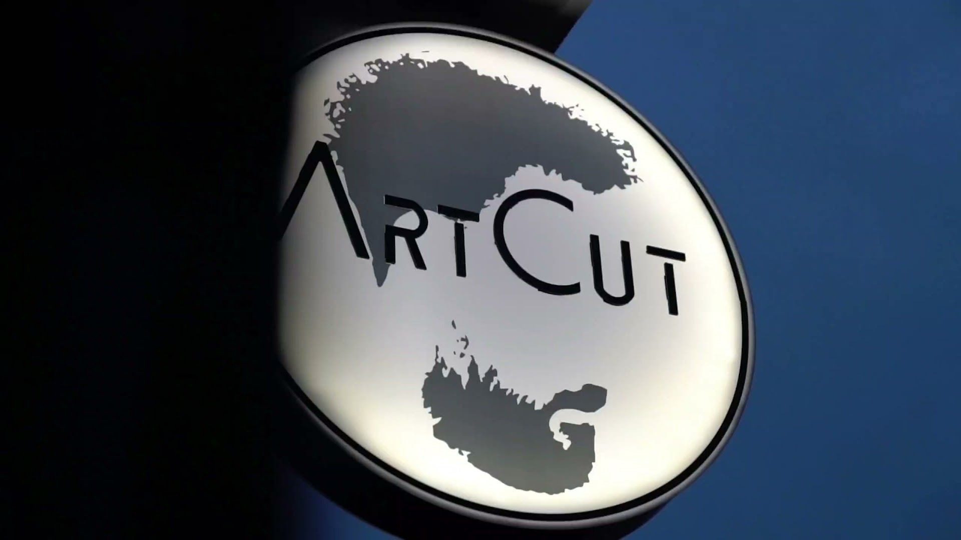 the logo of the artcui group is seen on a sign in front of a building in