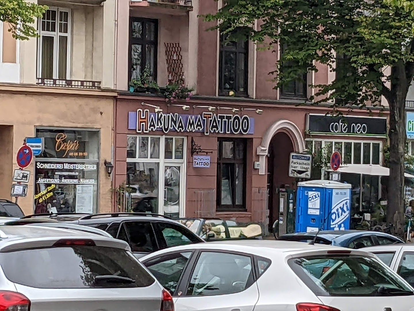 a street filled with cars parked on the side of it