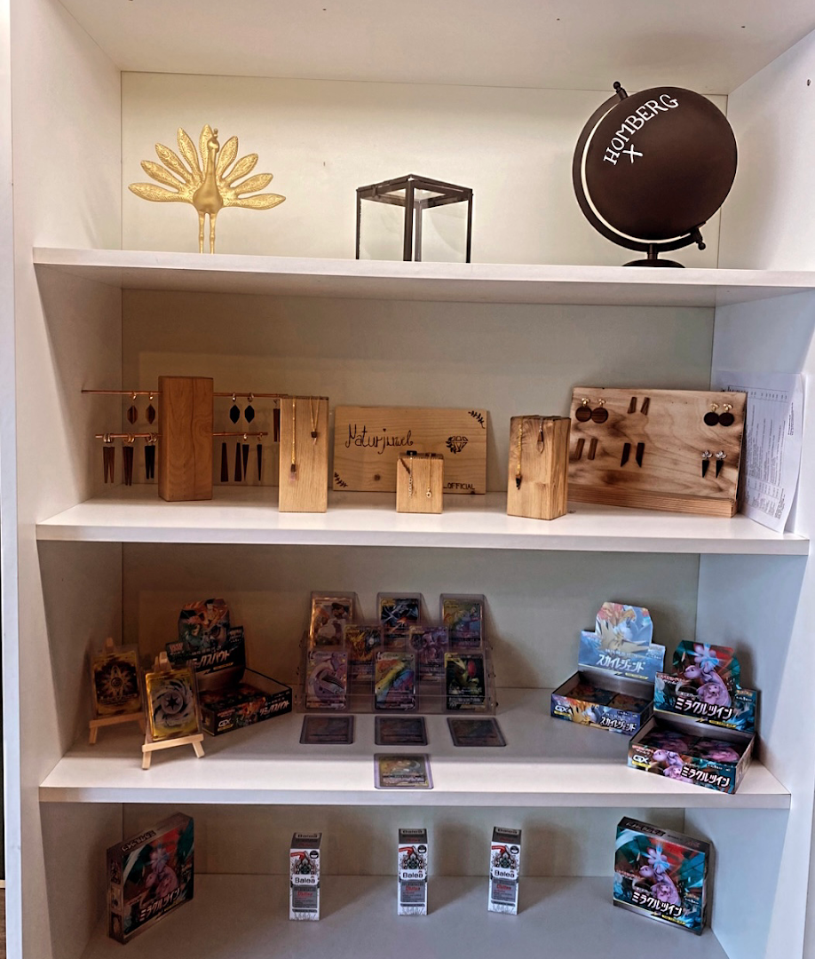 a shelf with books and toys on it