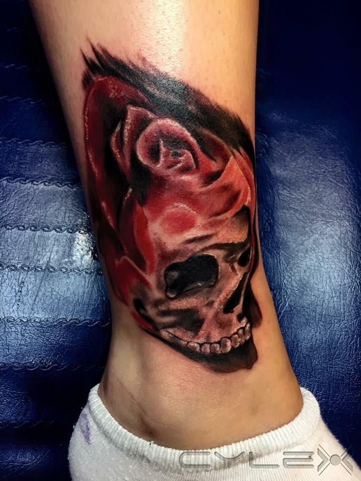 a cover-up tattoo of a skull with a red and black face, bernkastel-wittlich, germany