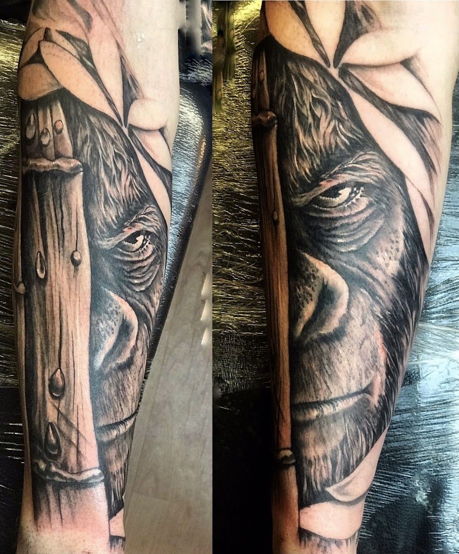 a black and grey narben tattoo of a lion with a hat on his head, bamberg, germany