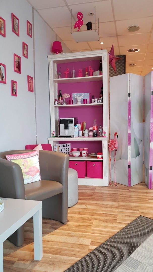 a room with a pink and grey theme