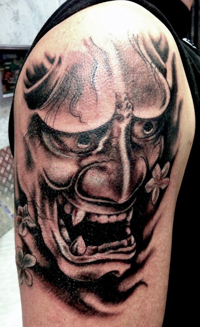 a cover-up tattoo of a clown with a big smile, göppingen, germany