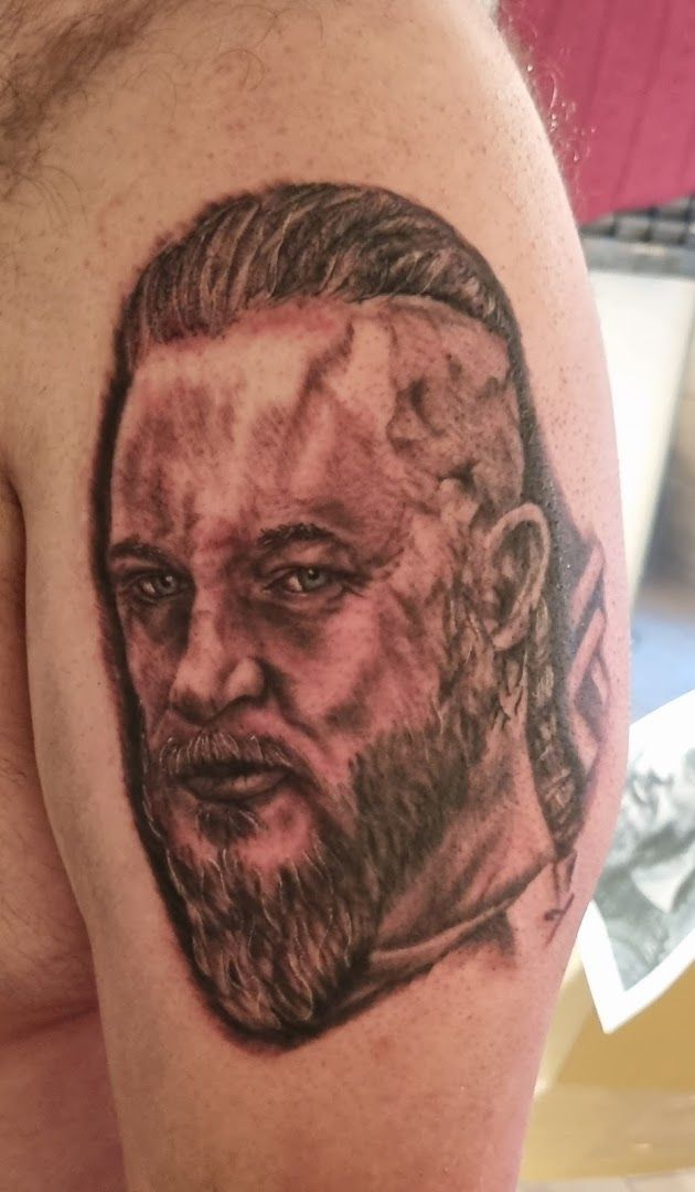 a man with a beard and a beard narben tattoo on his shoulder, börde, germany