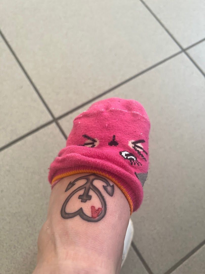 a person with a pink hat and a pink sock