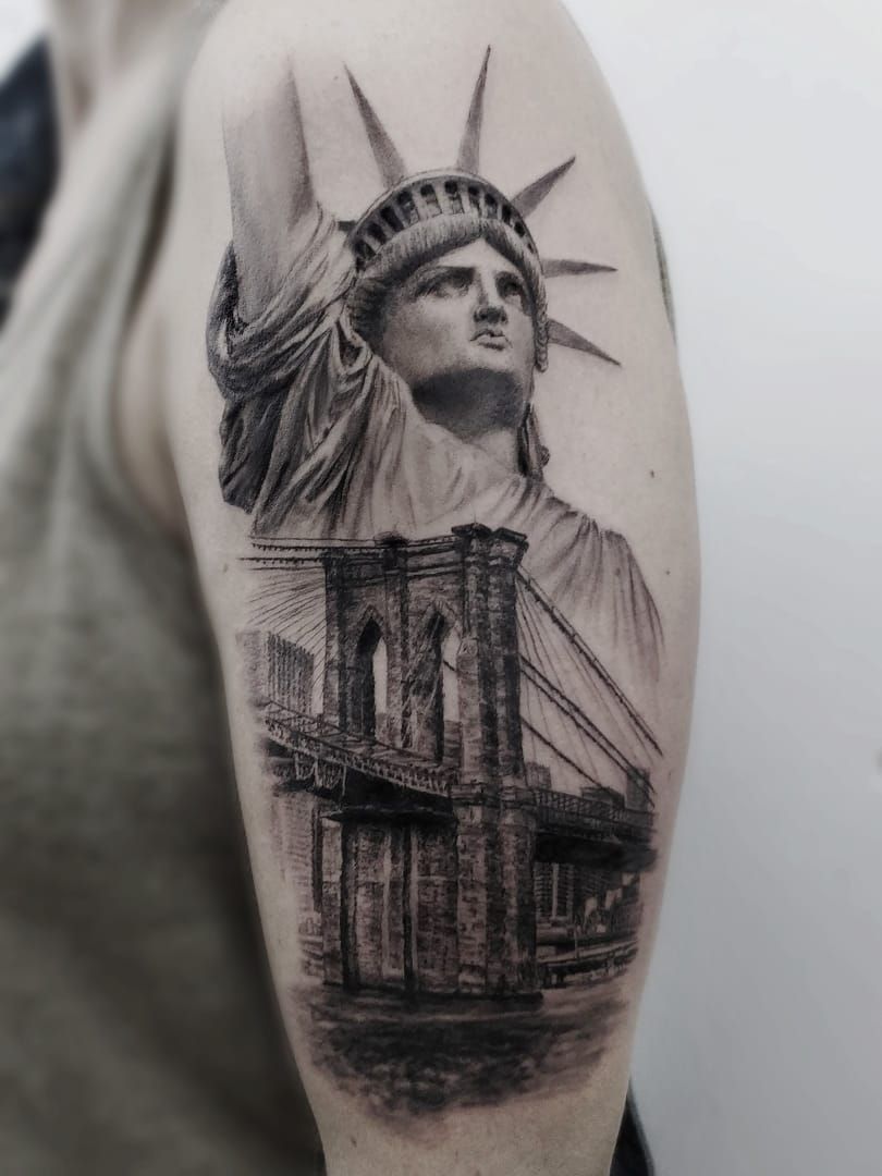 a statue of liberty cover-up tattoo on the arm, aschaffenburg, germany