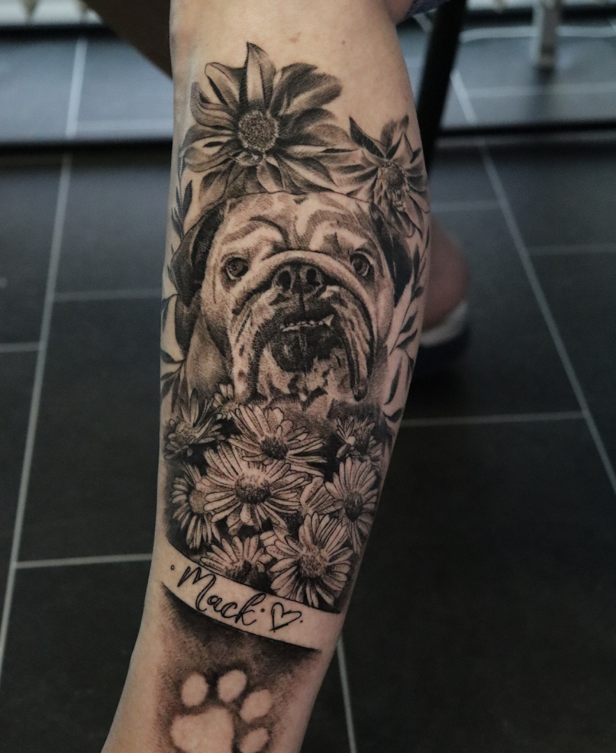 a cover-up tattoo of a dog with flowers on its leg, rhein-erft district, germany