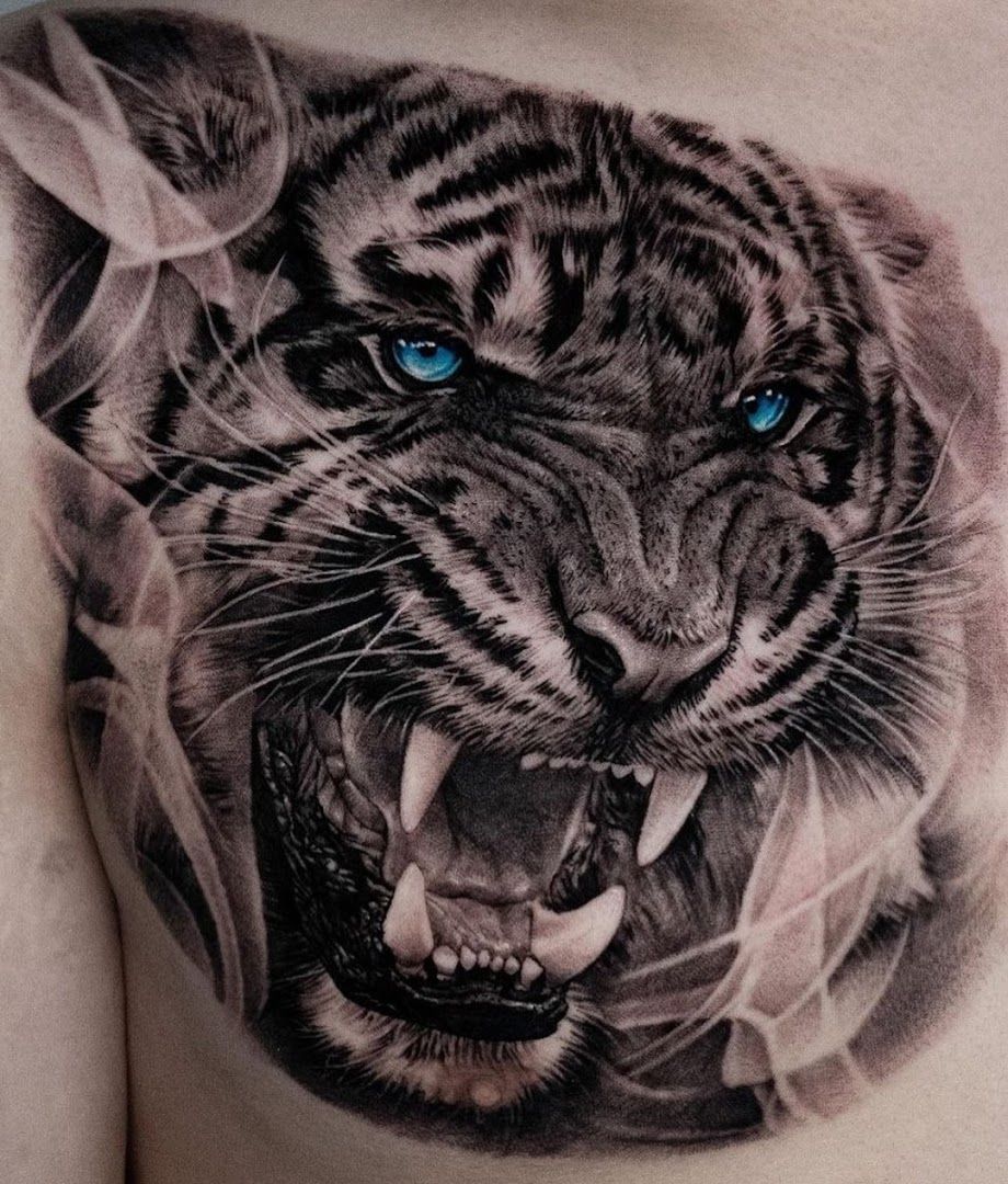 a black and white tiger cover-up tattoo on the chest, dachau, germany