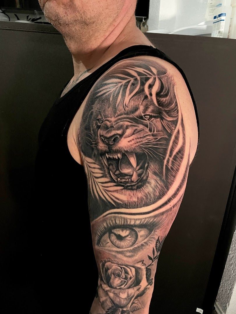 a man with a japanische tattoos in leipzig of a tiger and a lion, rhein-erft district, germany