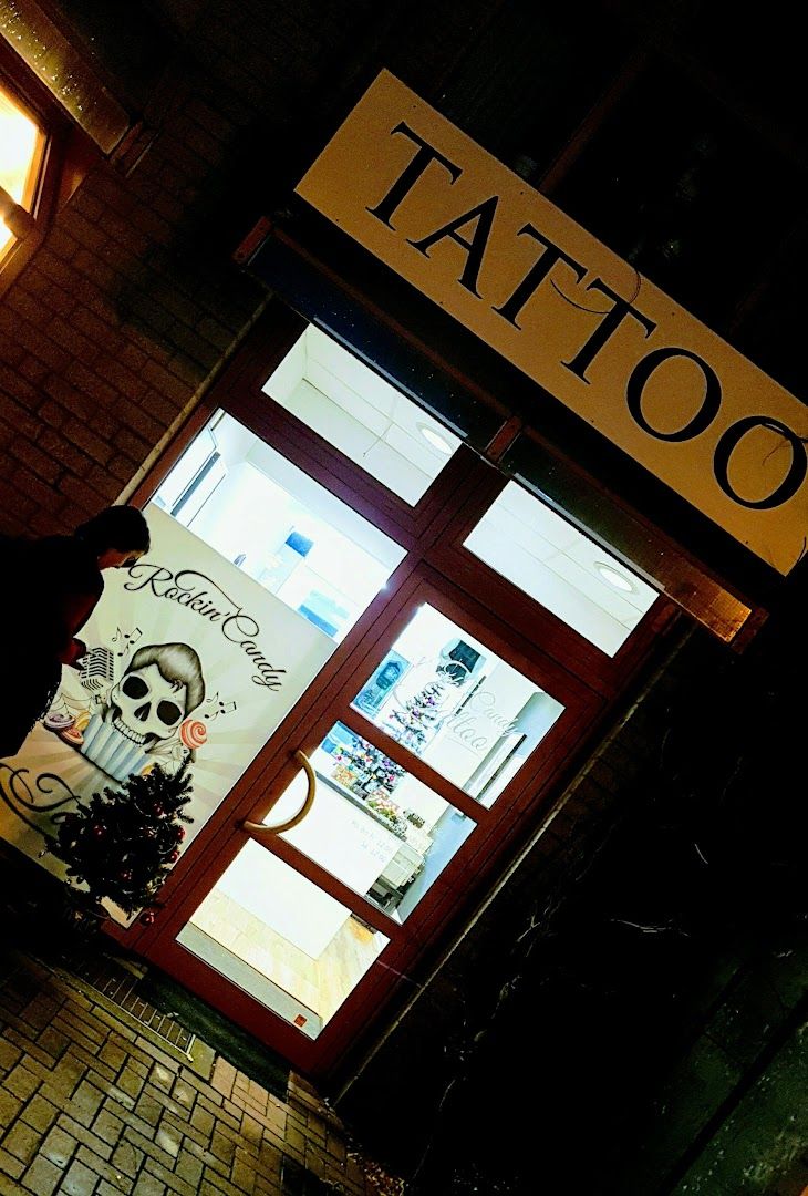 a man walking past a store with a sign on the door