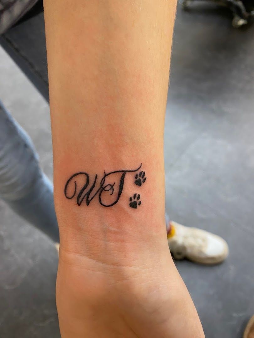 a small wrist narben tattoo with the word w on it, kreisfreie stadt ingolstadt, germany